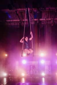 Katherine mechler, aerial cirque over denver coach and performer. Here she is on a dance trapeze.