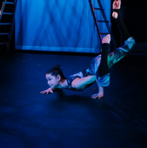 Two students do a contortion style backend at aerial cirque over denver's showcase