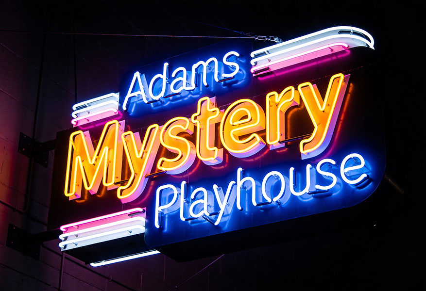 ACOD_neon-sign-that-reads-adams-mystery-playhouse--AerialCirqueOverDenver
