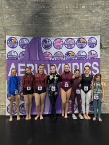 youth competition team at aerial cirque over denver at an in person competition. Here the whole team is shown at Aerialympic event.