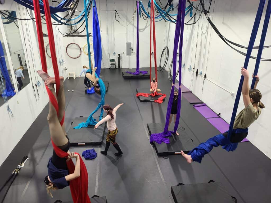 circus school denver studio view of six youth students on silks