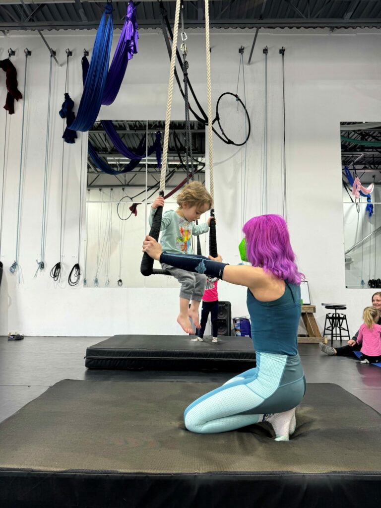 toddler dance class at aerial cirque over denver. Toddler on a trapeze