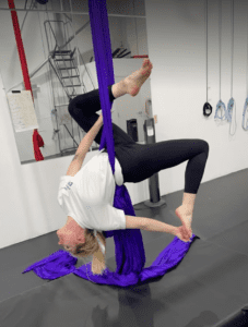 party booking, bachelorette party bride on aerial silks upside down