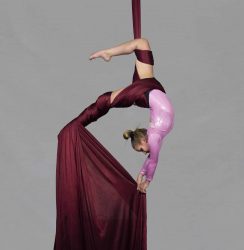 youth aerial dancer in circus camp denver on red silks