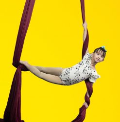 summer dance camp near arvada young dancer in mermaid pose on silks