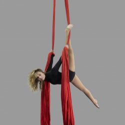 adult aerial classes aerial dance flexibility woman on red silks